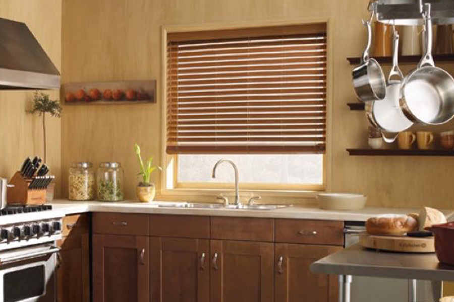 Blinds won't warp when installed over sinks or other rooms with humidity.
faux-wood blinds stained light oak