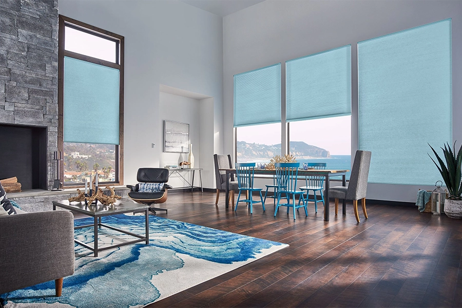 Smart motorized window shades are perfect on tall windows in your Atlanta home. Blue motorized shades on tall living room windows