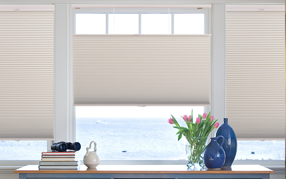 Energy efficiency with a modern twist in Atlanta. Cellular shades in oceanside beach house.